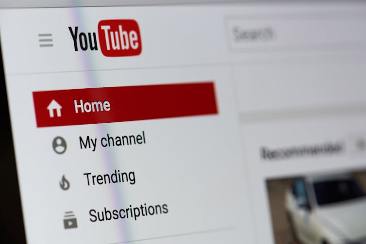 Red, black and white YouTube logo on a computer screen.
