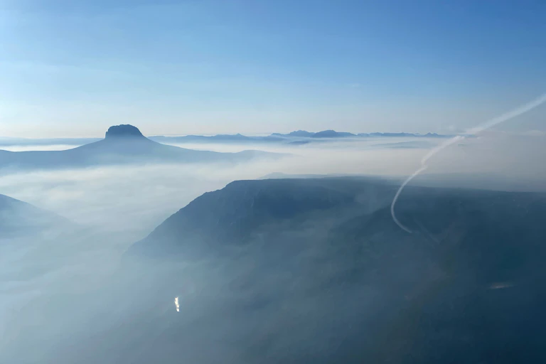 Smoke from an out of control bushfire rises over Canning Peak at Cradle Mountain, Tasmania, on Wednesday, February 5, 2025.