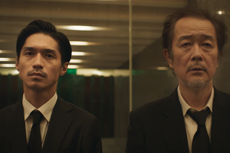 Ken and his son Toshi in black suits.