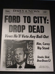 A tabloid newspaper with a photo of President Gerald Ford and the headline 'Ford to City: Drop Dead'