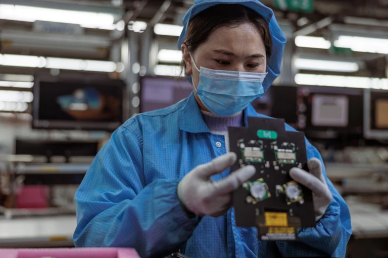 A woman worker in a tech factory.