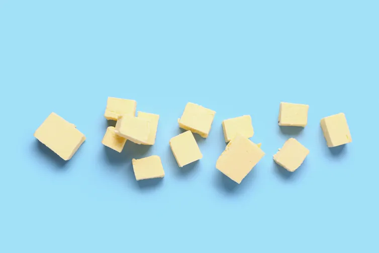 Cubes of butter against blue background