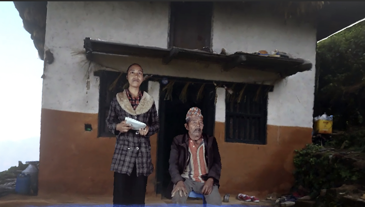 How digital truth may just assist revive endangered language and tradition 1 A young Nepalese girl standing with her grandfather, seated.