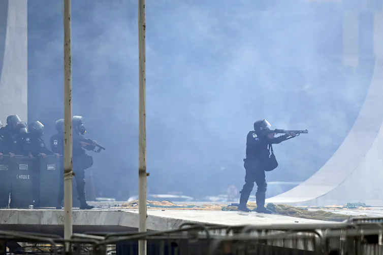 Riot police outside the presidential palace in Brasília.