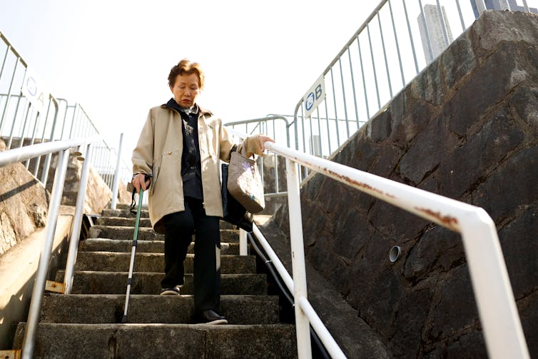 Woman descends steps