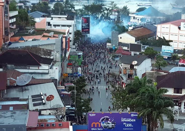 A protest in West Papua on a street.