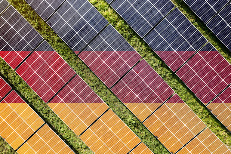 Aerial view of solar farm in colours of German flag.
