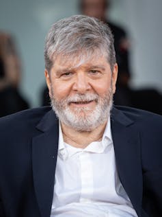 I’m Nonetheless Right here: a colourful testomony to feminine resilience that mourns Brazil’s darkish previous 2 A middle-aged man with greying hair wearing a blue suit jacket and white shirt.