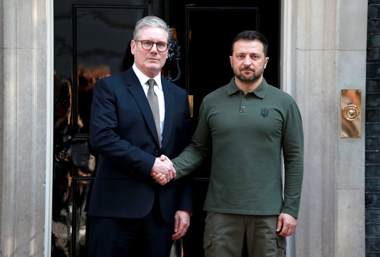 uk prime minister keir starmer shaking hands with ukrainian president volodymyr zelensky at downing street