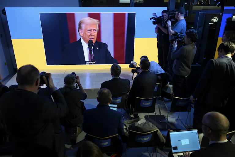 Donald Trump appears on a screen a tthe Wold Economic Forum in Davos.