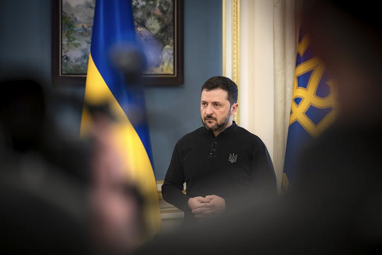 Trump’s artwork of the deal horrifies Ukraine and its allies 1 Ukraine’s president Volodymyr Zelensky flanked by two national flags.