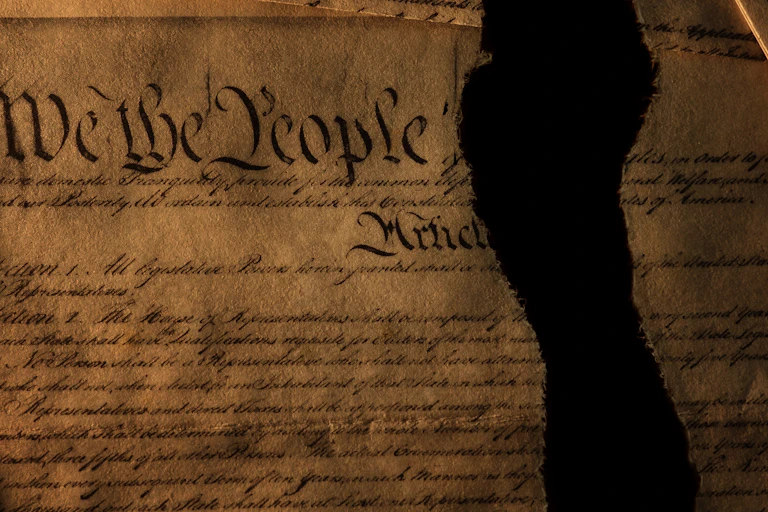 Image of the US Constitution ripped in half