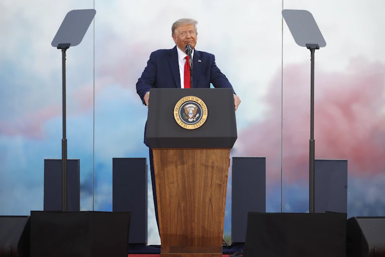 Man stands alone on podium.
