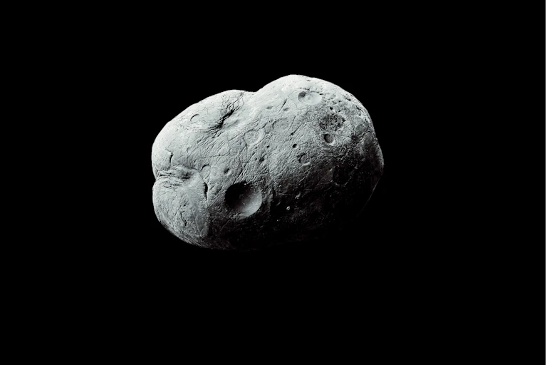 Asteroid-like rock floating in black space