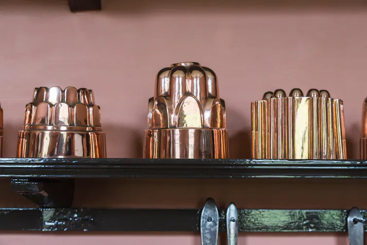 Jelly moulds on a shelf.