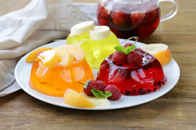 Fruit jellies on a white plate.