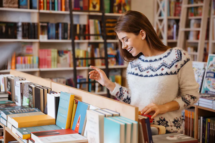 woman looking at books