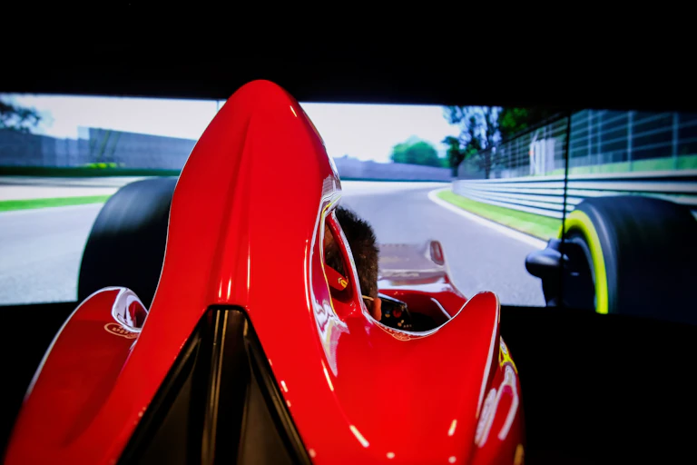 A Ferrari test drive simulator cockpit at the Ferrari Museum in Italy.