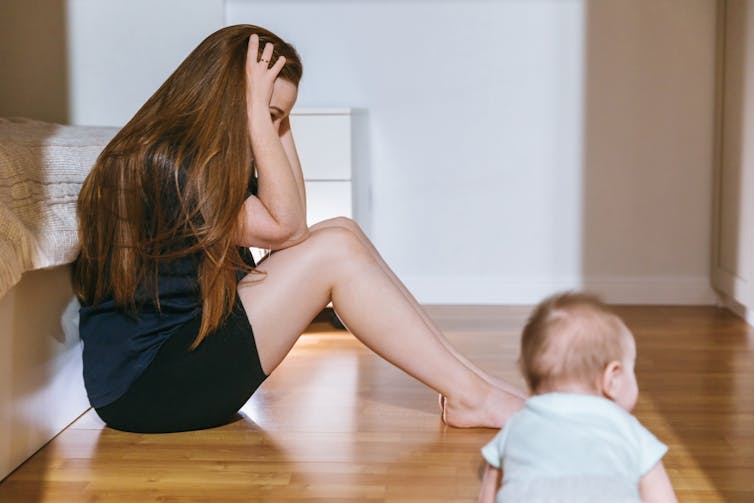 A mother feeling overwhelmed with a toddler.