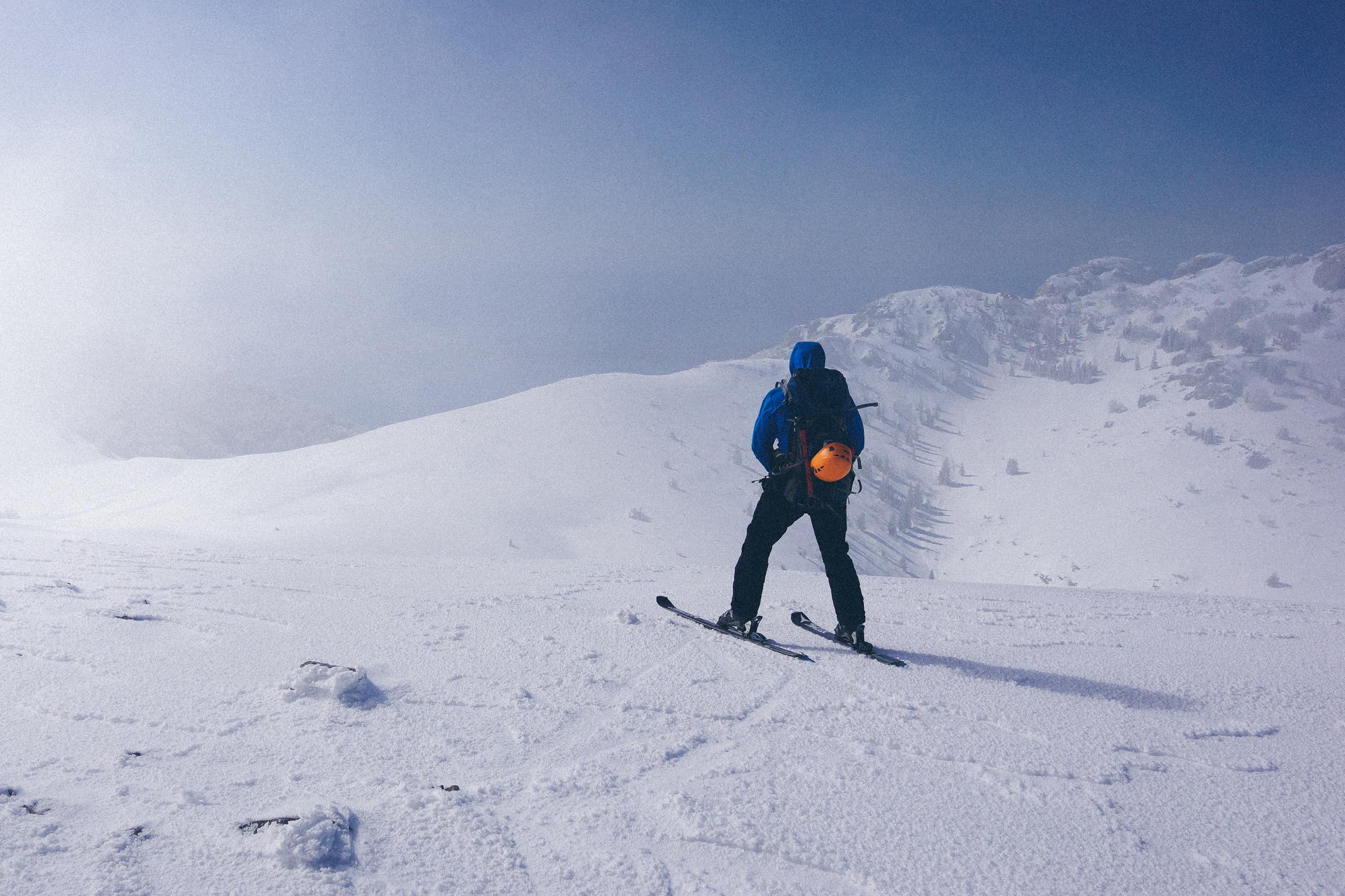 A skier on a ski slope.