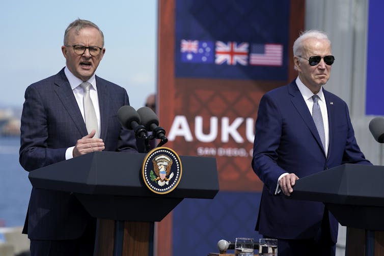 Australian Prime Minister Anthony Albanese stands with former United States President Joe Biden.