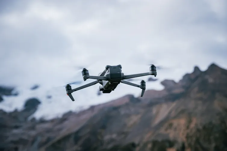 Drone flying near a hill