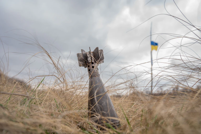 An unexploded mortar shell in a field in Ukraine.