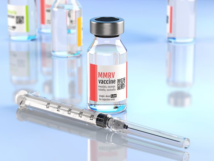 A vial of MMR vaccine with syringe