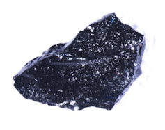 Photo of a glittering black chunk of glass.