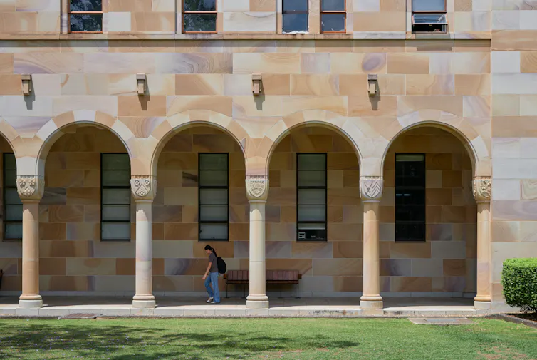 Student walking on university campus