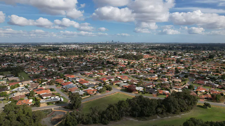 An aerial shot displays houses in a Perth suburb.