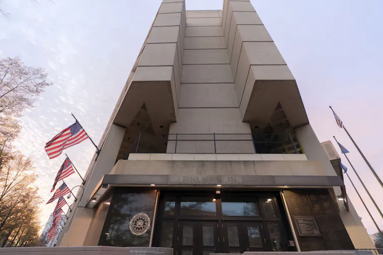 A building with American flags lining the side