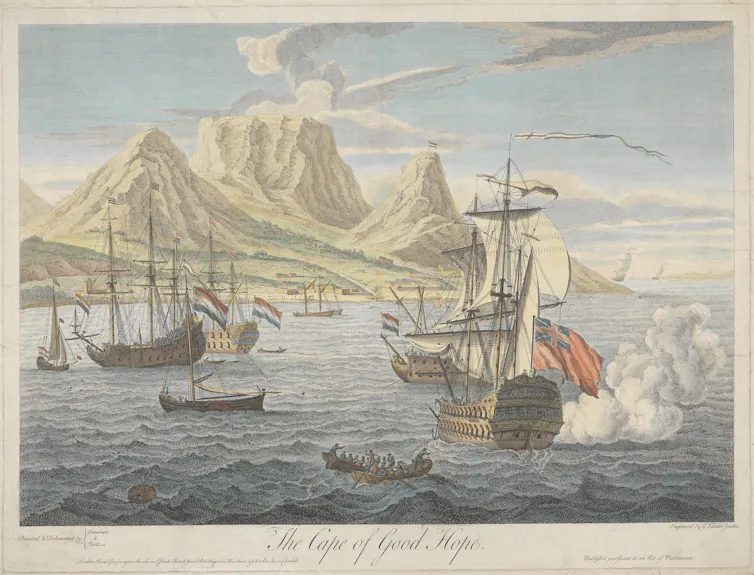An old colour illustration of ships in a bay with high mountains.