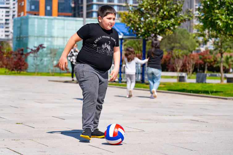 Boy kicks ball