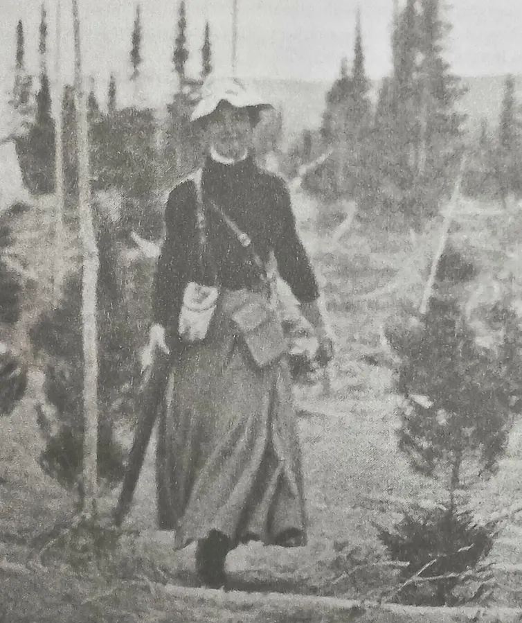 Mina Hubbard black and white photo of woman striding towards camera