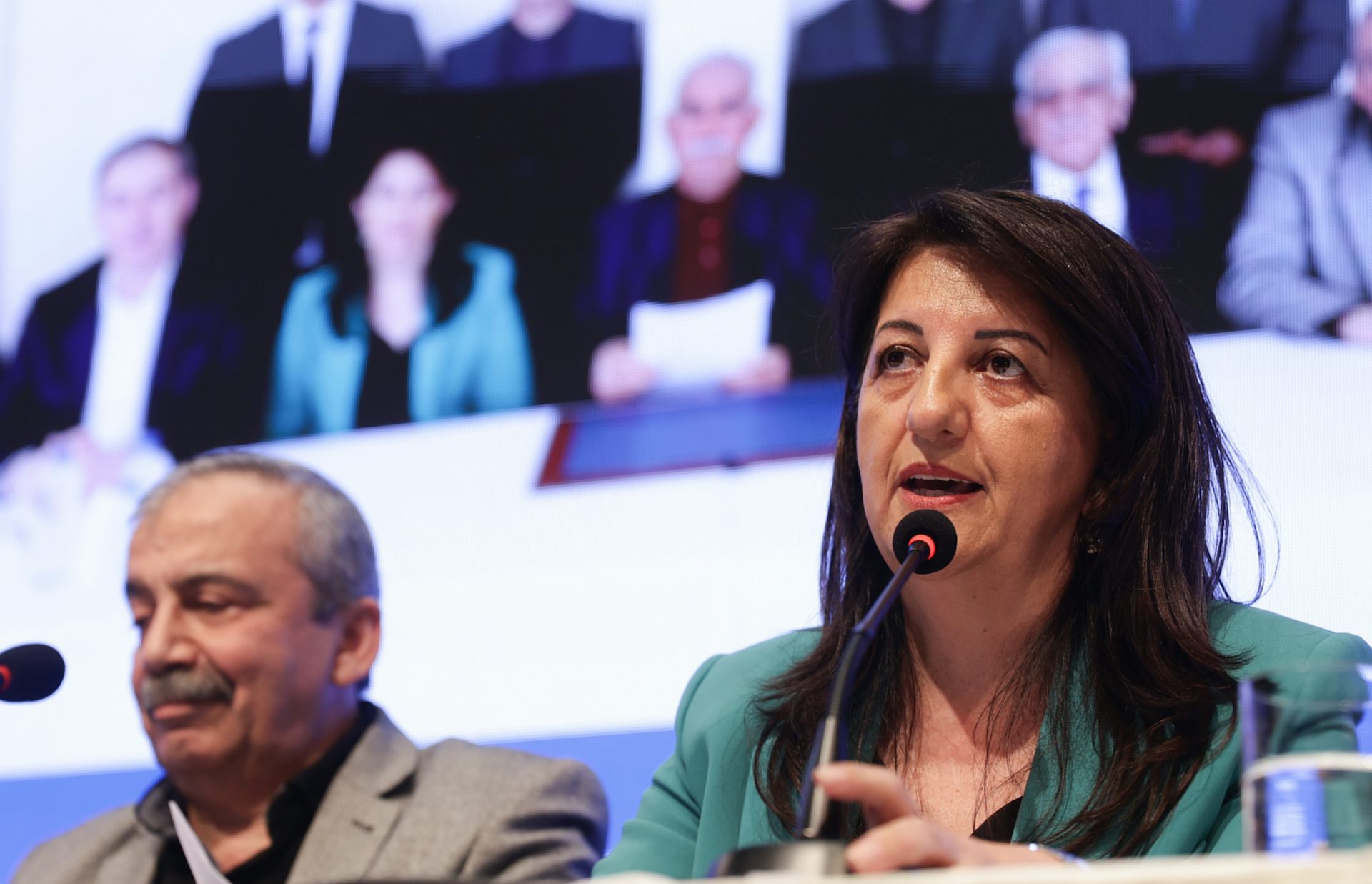 Two Turkish politicians addressing a press conference.