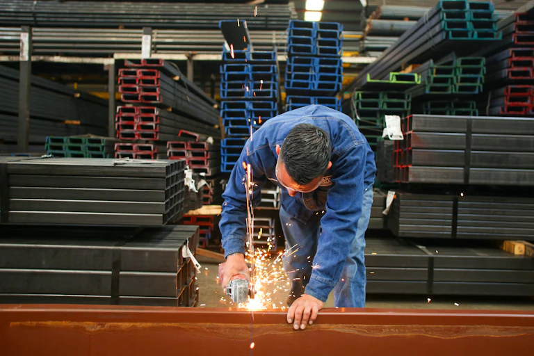 Man works in a factory.