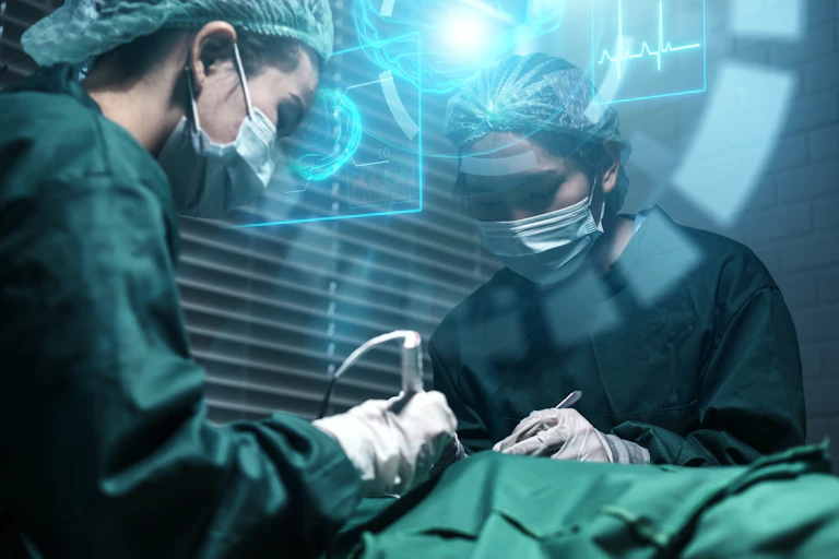 Two female surgeons operate with help frm artificial intelligence.