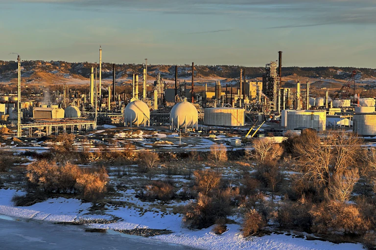 A large cluster of industrial buildings and towers.