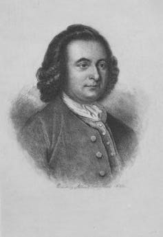 A man with long hair in the colonial style, with a white shirt and dark jacket.