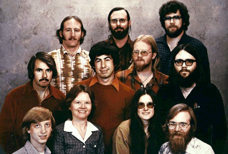 A photo of young people in the 1970's many with beards.
