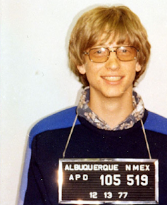 Mug shot of a young, fair-haired Gates.