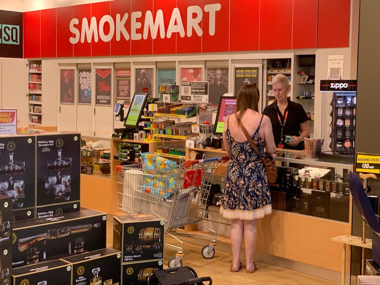 Woman buys tobacco products