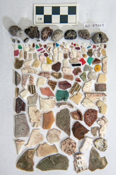 A neatly arranged collection of various shards and pieces, as well as pumice (volcanic rock that floats).
