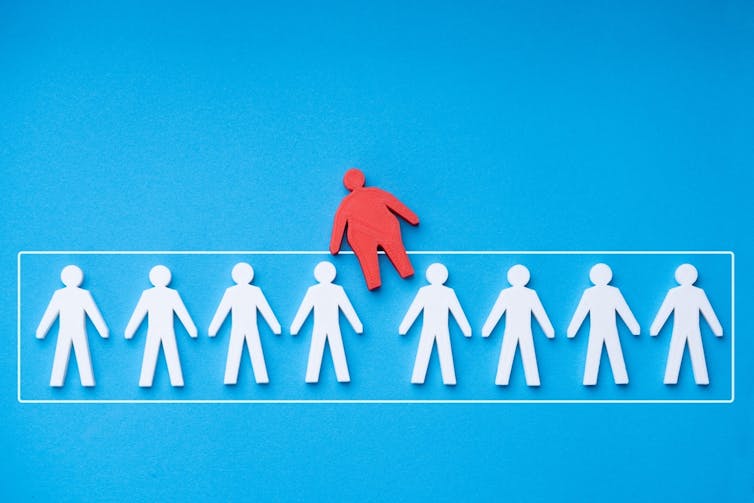 White Paper Cut out is being enrolled in a line of human data and a large red personality