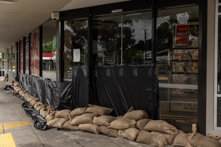 sandbags and plastic sheeting