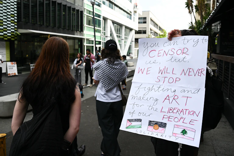 Sign reads: you can try to censor us but we will never stop.