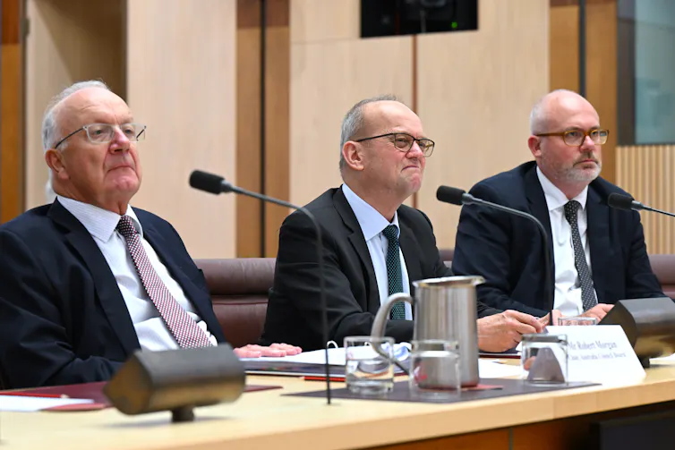 Three men in suits.