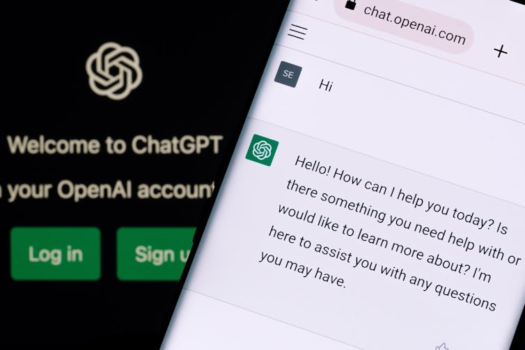 ChatGPT chat bot screen seen on smartphone and laptop display with Chat GPT login screen on the background.