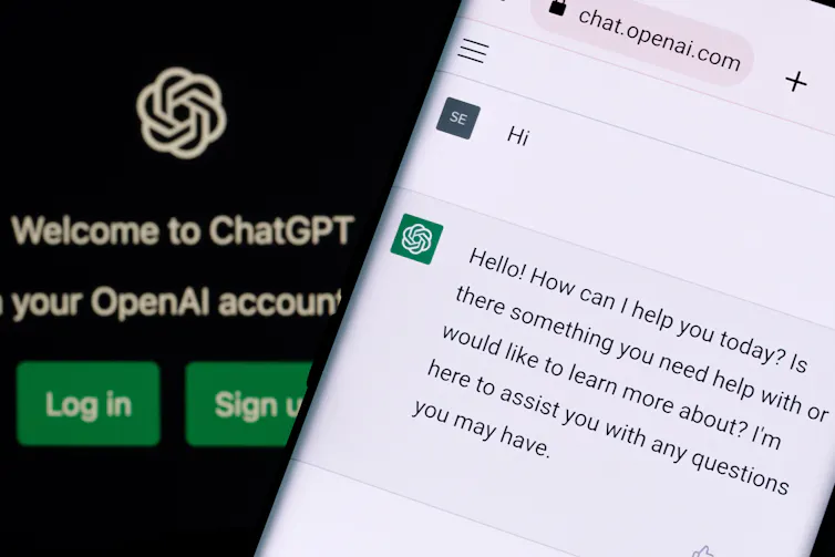 ChatGPT chat bot screen seen on smartphone and laptop display with Chat GPT login screen on the background.